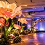 Large paper flower arrangement transforming a venue