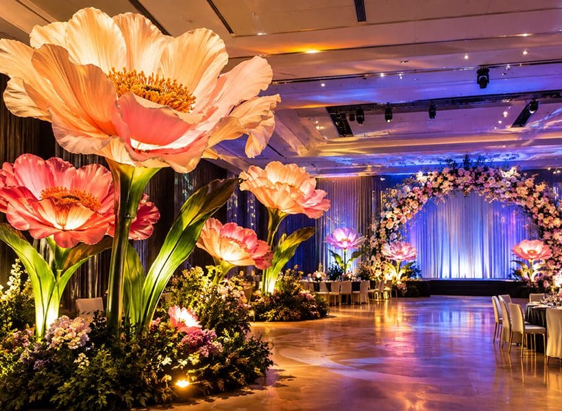Large paper flower arrangement transforming a venue