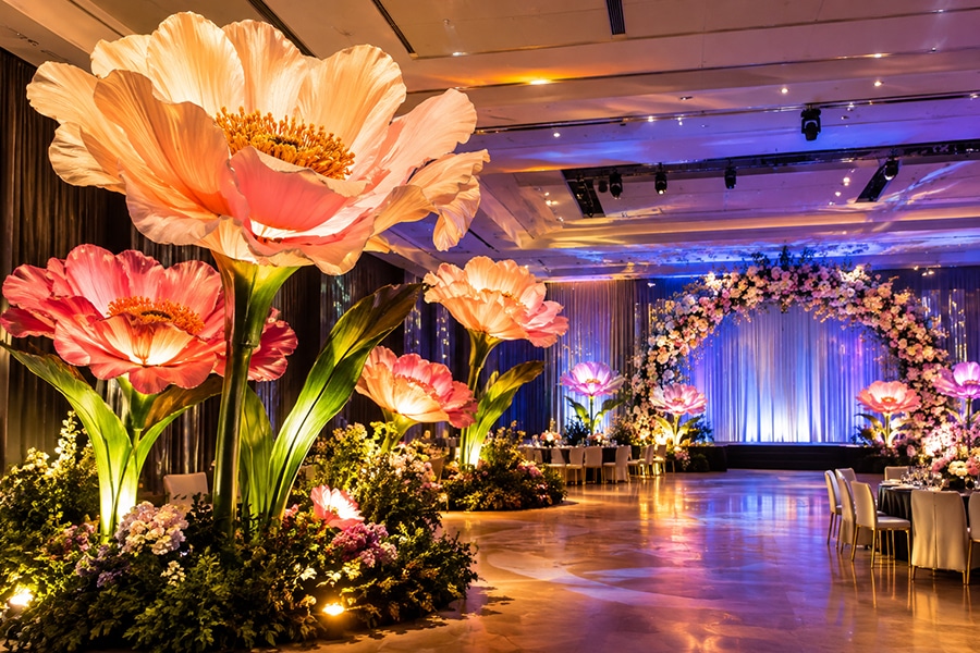 Large paper flower arrangement transforming a venue