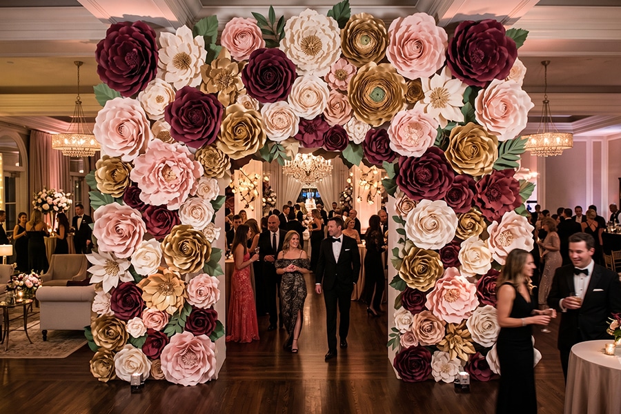 Oversized paper flower installation creating a dramatic focal point at a luxury event